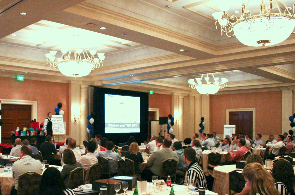 Rick Lambert presenting in an event hall